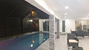 a house with a swimming pool in a room at Paradise Cape Vacation in Cape Coral
