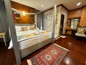 Postel nebo postele na pokoji v ubytování Baan SanSuk Pranburi - Beach Front & Pool Villa