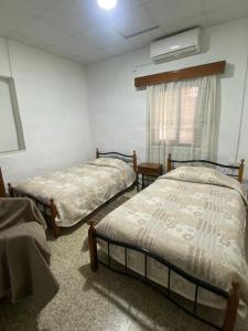 Postel nebo postele na pokoji v ubytování Christos House + 13 fotografií