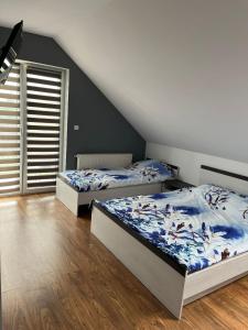 Postel nebo postele na pokoji v ubytování Relax u Agi i Jurka