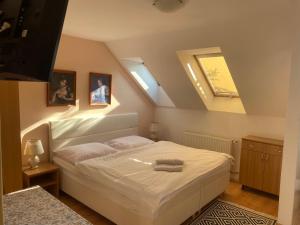A bed or beds in a room at Penzion Rosnicka Liesek