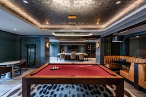 a pool table in the middle of a room at Clarendon 1BR w Gym WD Pool nr Metro WDC-381 in Arlington
