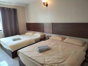 Postel nebo postele na pokoji v ubytování 39 Lot 10 Pangkor Leisure Beach Studio
