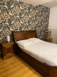 Łóżko lub łóżka w pokoju w obiekcie La Chambre d'Angèle
