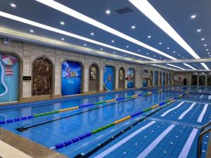 a large swimming pool with a lanesop at Pullman Beijing South - Newly Renovated in Beijing