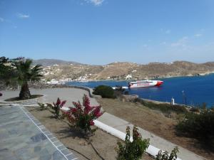 a boat is docked in a body of water at Gaia house, Ios Greece in Tzamaria +11 photos