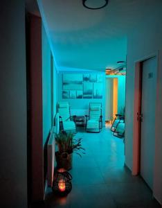 a living room with a table and chairs at Tetris domky v Beachklubu Ládví in Prague