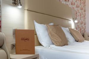 Postel nebo postele na pokoji v ubytování Aphrodite Beach Hotel