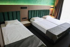 Postel nebo postele na pokoji v ubytování Atliman Beach Park Hotel