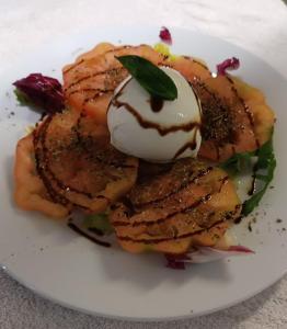 a plate of food with a dessert on it at Albergo La Conca Azzurra in Conca dei Marini