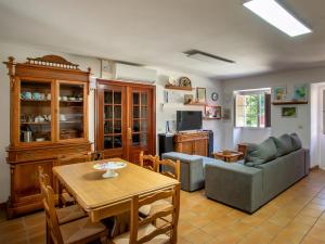 a living room with a couch and a table at QUINTA do SOUTO BARCIADEMERA in Barciademera