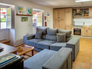 a living room with a couch and a table at QUINTA do SOUTO BARCIADEMERA in Barciademera
