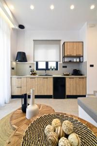 a kitchen with a wooden table in a room at Gemilos Harmony in Adamas