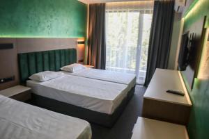 Postel nebo postele na pokoji v ubytování Atliman Beach Park Hotel