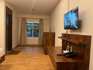TV a/nebo společenská místnost v ubytování Inika