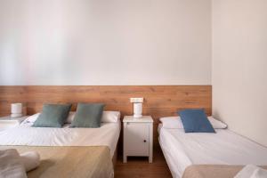 Posteľ alebo postele v izbe v ubytovaní Fira Barcelona Apartment