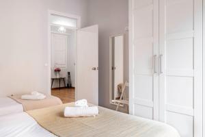 Posteľ alebo postele v izbe v ubytovaní Fira Barcelona Apartment