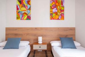 Posteľ alebo postele v izbe v ubytovaní Fira Barcelona Apartment