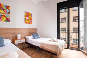 Posteľ alebo postele v izbe v ubytovaní Fira Barcelona Apartment