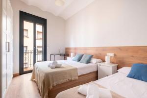 Posteľ alebo postele v izbe v ubytovaní Fira Barcelona Apartment