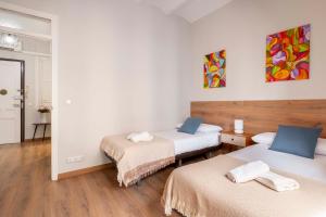 Posteľ alebo postele v izbe v ubytovaní Fira Barcelona Apartment