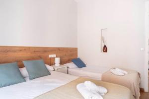 Posteľ alebo postele v izbe v ubytovaní Fira Barcelona Apartment