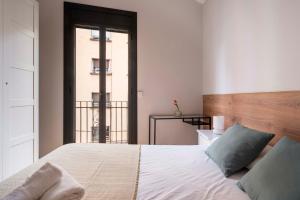Posteľ alebo postele v izbe v ubytovaní Fira Barcelona Apartment