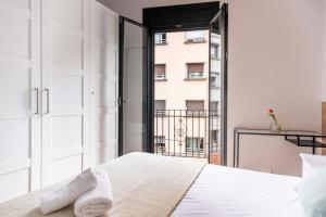 Posteľ alebo postele v izbe v ubytovaní Fira Barcelona Apartment