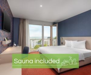 Postelja oz. postelje v sobi nastanitve b-smart hotel Arbon