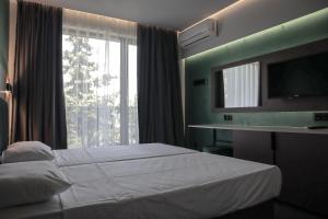 Postel nebo postele na pokoji v ubytování Atliman Beach Park Hotel