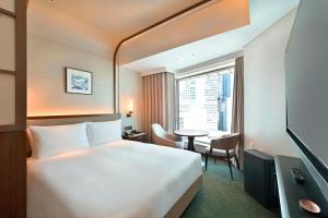 TV a/nebo společenská místnost v ubytování Marunouchi Hotel