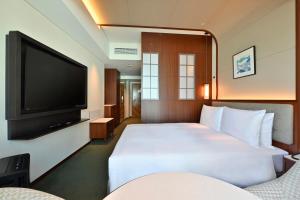 TV a/nebo společenská místnost v ubytování Marunouchi Hotel