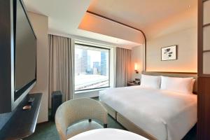 TV a/nebo společenská místnost v ubytování Marunouchi Hotel
