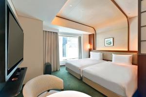 TV a/nebo společenská místnost v ubytování Marunouchi Hotel