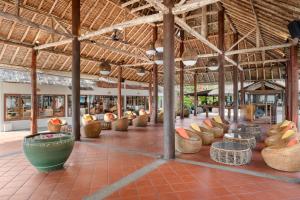 a building with lots of pots and baskets on the floor at SAii Phi Phi Island Village in Phi Phi Islands