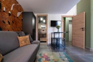 a living room with a couch and a table at Vatican Boutique Apartment with large Terrace in Rome