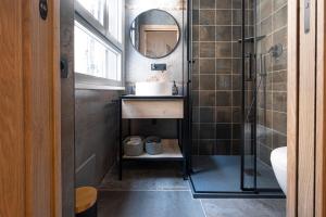 a bathroom with a sink and a mirror at Vatican Boutique Apartment with large Terrace in Rome +90 photos