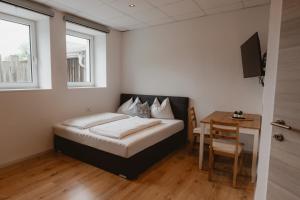 Postel nebo postele na pokoji v ubytování Kalkalpen Apartments