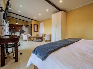 a bedroom with a bed and a piano at Private Studio flatlet, Uncapped Wifi, Netflix,Full DSTV in Durban