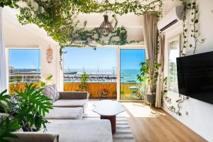 a living room with a view of the ocean at Luxury Apartment - Gordon Beach View 124 in Tel Aviv