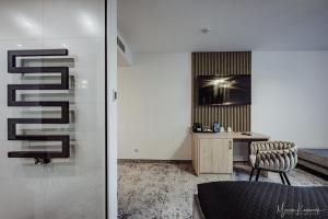 a bedroom with a desk and a chair in a room at Cristal in Ustka