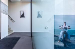 a person sitting on a scooter in a room at Duinhotel Tien Torens in Zoutelande