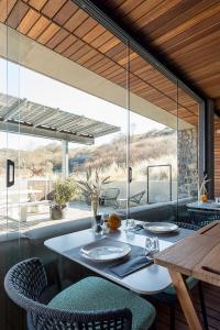 a dining room with a table and chairs at Duinhotel Tien Torens in Zoutelande