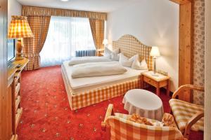 Postel nebo postele na pokoji v ubytování Hotel Pfeifer + 37 fotografií
