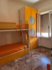 a room with two bunk beds and a window at Casa Giovenza in Porto Azzurro +16 photos