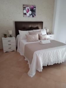 Posteľ alebo postele v izbe v ubytovaní Casa nueva en Urbanización la Biznaga