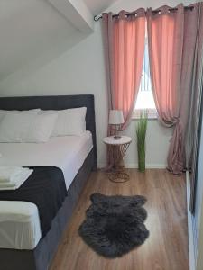 Katil atau katil-katil dalam bilik di Apartman Dawidh