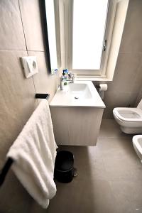 Koupelna v ubytování Tigullio Suites Rapallo + 12 fotografií