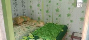 Ліжко або ліжка в номері Javalindra Homestay Tour and Travel