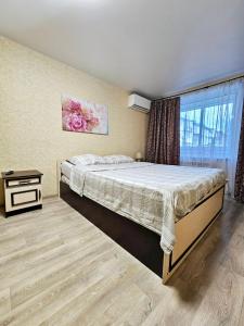 Posteľ alebo postele v izbe v ubytovaní Аккуратная , чистая квартира на Пр Гагарина 169